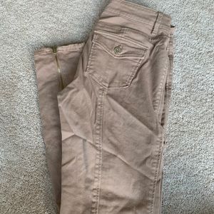 Tan pants with zippers